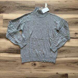 Hem and Thread Sweater